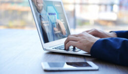 Man video conferencing on laptop. Webinar and consultation online. Modern business technology concept.